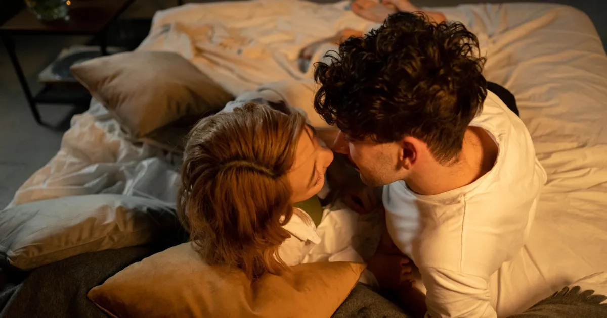 A Libra man with woman in bed