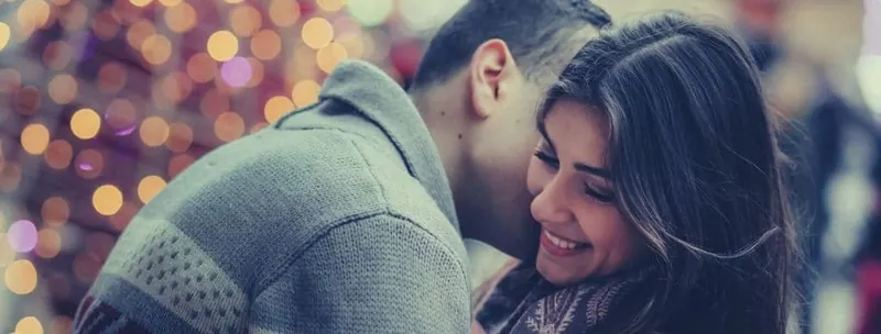Gemini man kissing his girlfriend